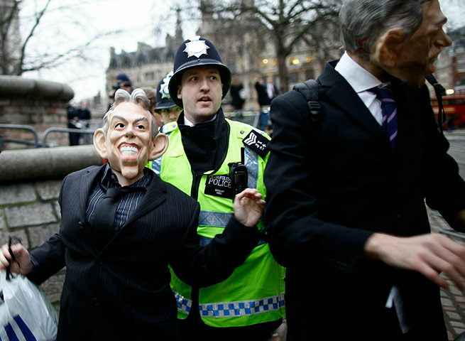 blair at iraq inquiry: Protestors with Tony Blair masks
