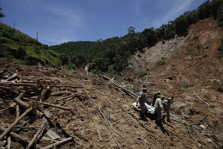24 hours in pictures: body of a landslide victim in Brazil