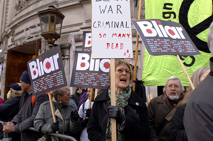 blair at chilcot: Demonstrators with placards outside the Iraq War Inquiry