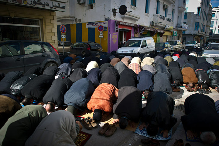 Tunisia: People pray on the streets in central Tunis on the national day of mourning