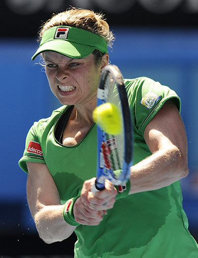 Australian Open Day 6: Kim Clijsters fires a backhand return to Alize Cornet 
