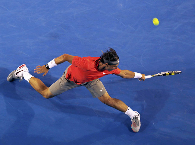 Australian Open Day 6: Rafael Nadal hits a return to Bernard Tomic