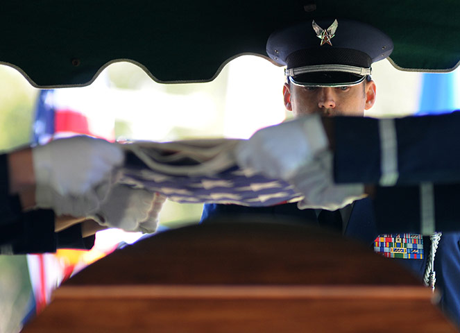 24 hours in pictures: Dale County, Alabama, USA: A flag is folded at a ceremony