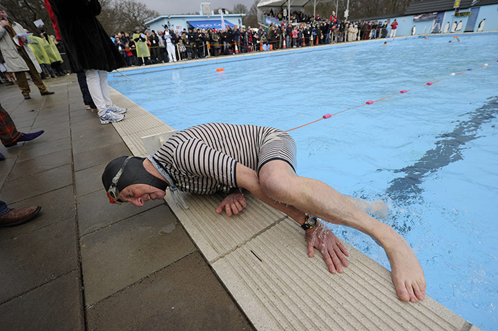 Cold water swimming: Robin Hunter-Coddington, 70, struggles to get out of the pool