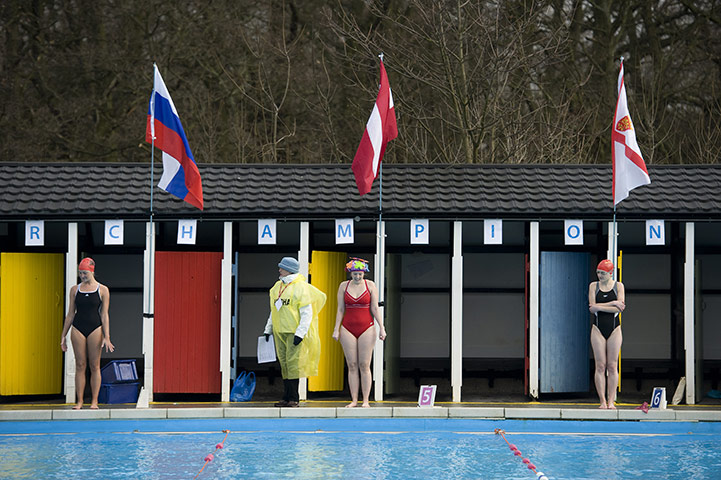 Cold water swimming: Three ladies and a marshall just before a race