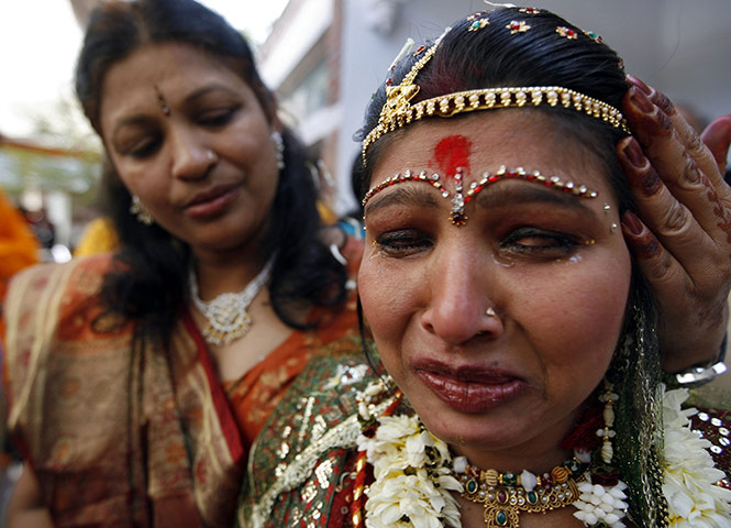 24 hours in pictures: A blind bride weeps