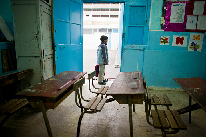 Tunisia Protests: A boy waits in his school in the center of Tunis