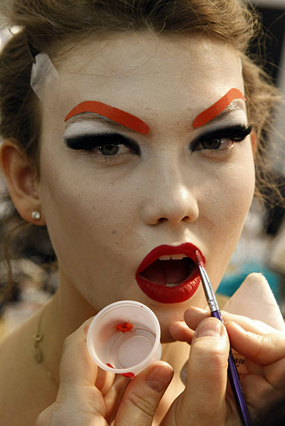 Paris Fashion Week: A model in make up before the show backstage