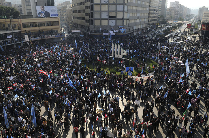 Lebanon Protests: Demonstrators carry flags during a protest
