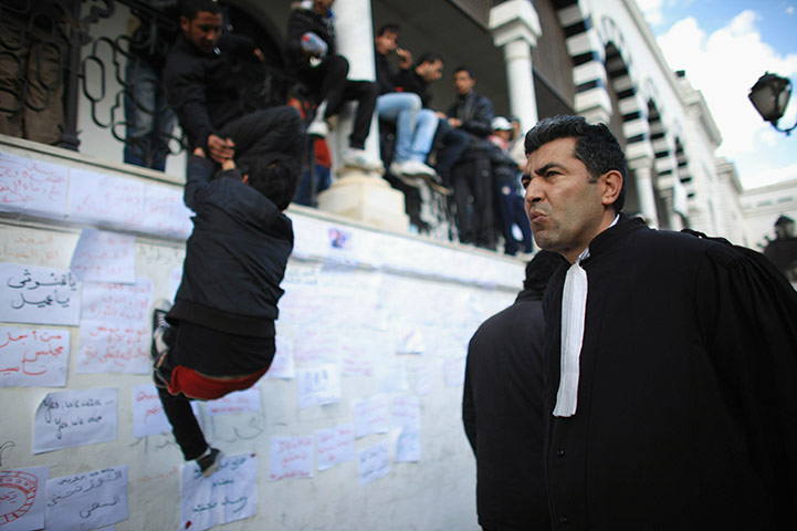 24 hours in pics: Lawyer joins demstrators outside the Tunisian prime ministers office