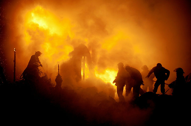24 hours in pics: Firefighters try to extinguish a fire in a market district, Afghanistan