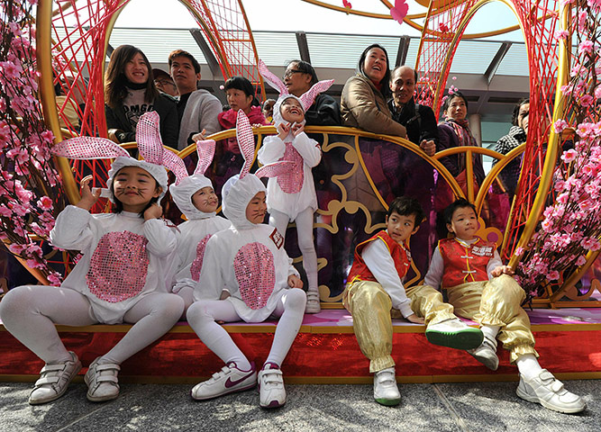 24 hours in pics: Children take part in an early Chinese New Year performance
