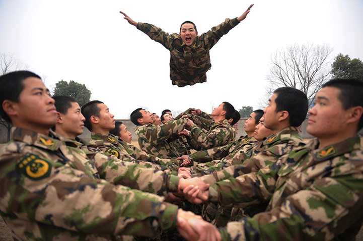 24 hours in pics: Police officer flies into teammates arms during a team building exercise