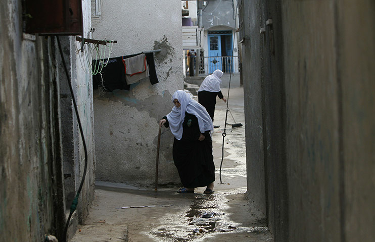 24 hours in pics: Palestinian refugees walk in the Jabalia refugee camp