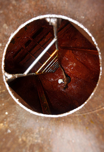 24 hours in pictures: A worker cleans palm oil in Jakarta