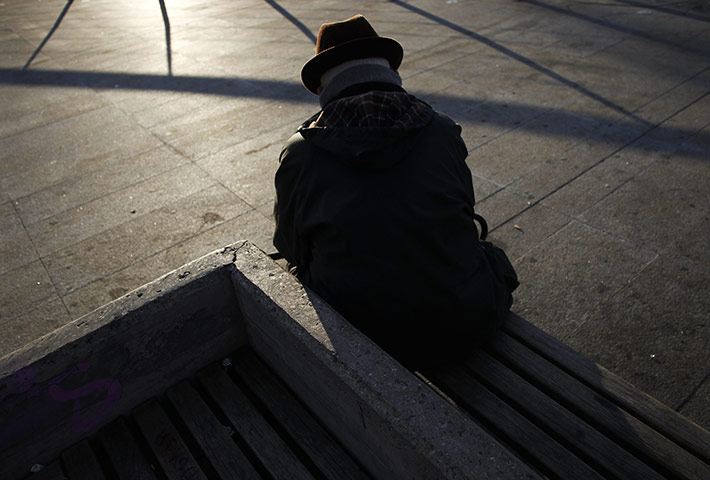 24 hours in pictures: An elderly man sits on a bench in Madrid