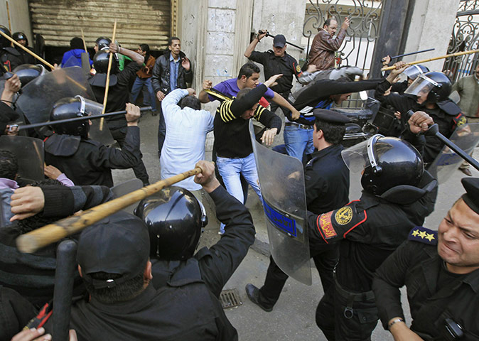 24 hours in pictures: Riot police clash with protesters in Cairo