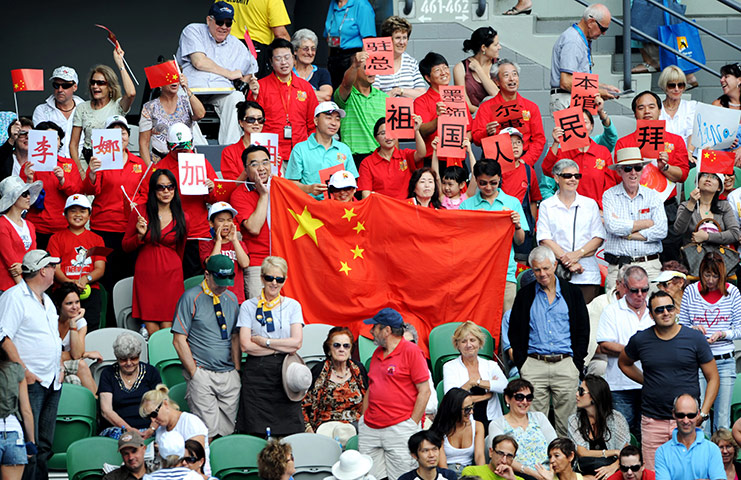 Melbourne Day 11: Fans of China's Li Na cheer during her semi-final match