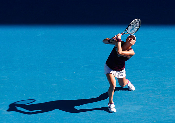 Melbourne Day 11: Zvonareva of Russia plays a shot to Clijsters during their semi-final