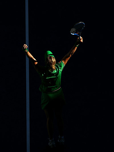 Melbourne Day 11: Kim Clijsters of Belgium celebrates winning her semifinal match