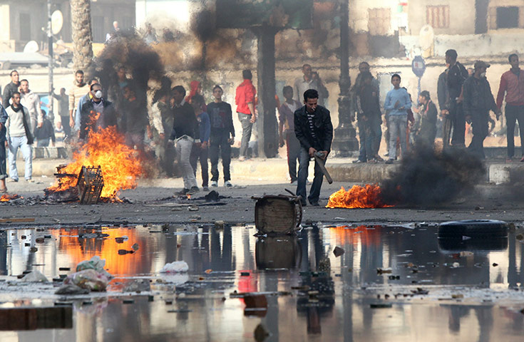 Egypt violence continues: Egyptian demonstrators burn tyres during demonstration in Suez