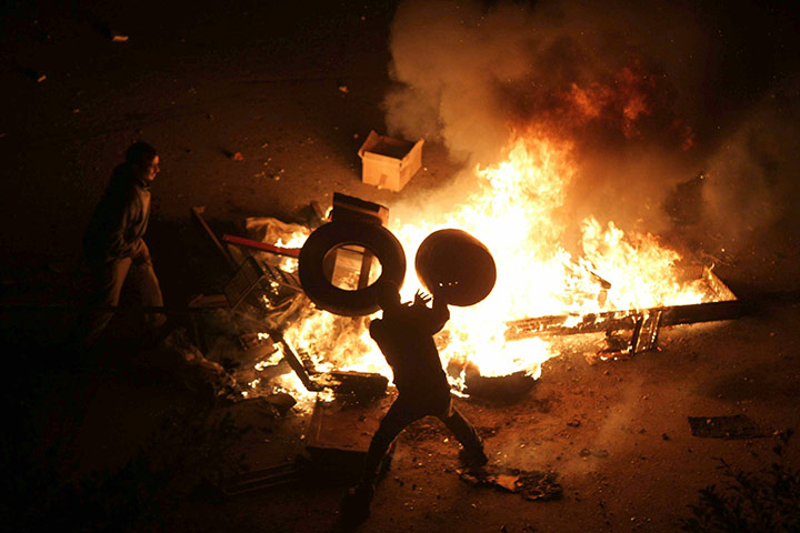 Egypt Protests: Egyptian demonstrators burn tyres