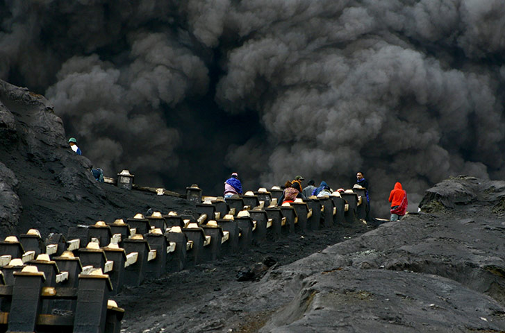 24 hours in pictures: Indonesian worshippers climb towards the crater of Mount Bromo