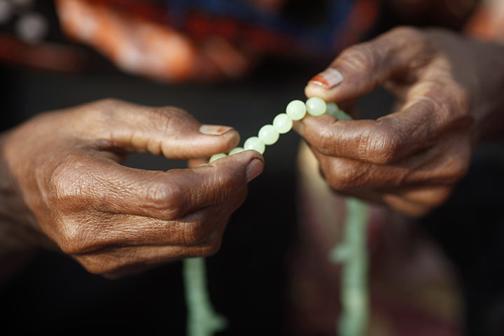 24 hours in pictures: A muslim devotee with prayer beads in Dhaka