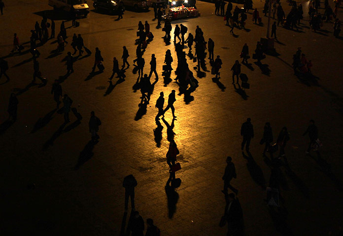 24 hours in pictures: Passengers in Beijing Railway Station 