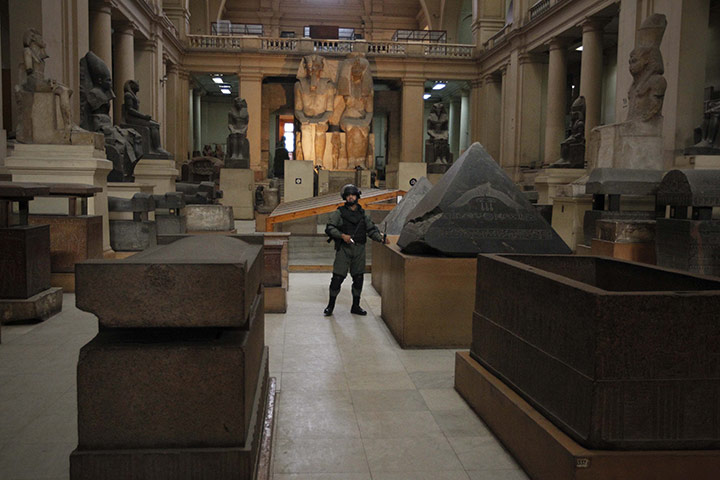 Egypt uprising: A member of the Egyptian special forces stands guard in the Egyptian Museum