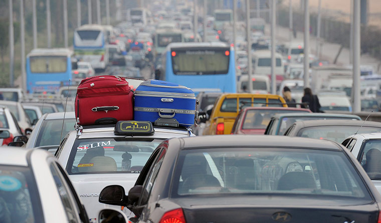 Egypt uprising: Cars in a traffic jam as they try to reach Cairo airport 