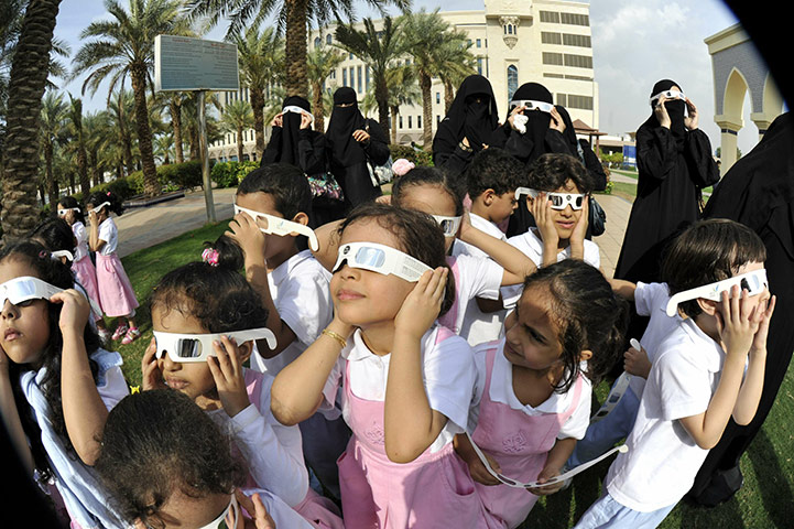 eclipse update: Saudis wear special tinted glasses to watch a partial solar eclipse