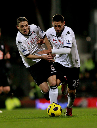 Tuesday Premier League: Team-mates Clint Dempsey and Chris Baird clash for the ball