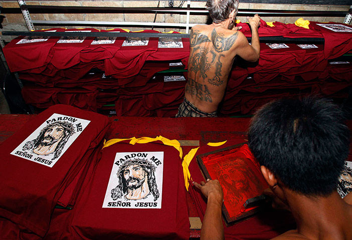 24 hours in pictures: A worker prints an image of 