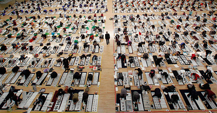 24 hours in pictures: Participants write at a calligraphy contest in Tokyo