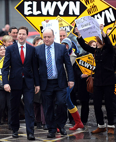 Nick Clegg in Oldham: A protester gets close to Nick Clegg