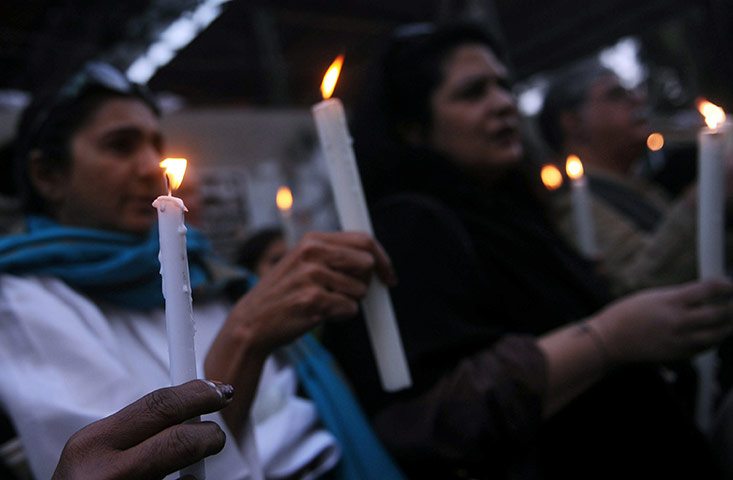 Salman Taseer Funeral: Pakistani activists and supporters of Salman Taseer hold lit candles