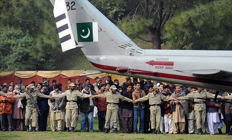 Salman Taseer Funeral: Pakistan paramilitary soldiers act as a human barrier