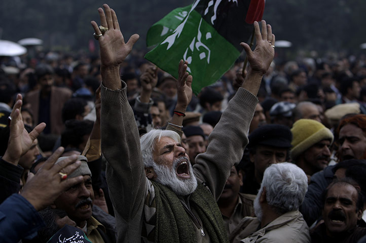 Salman Taseer Funeral: A Pakistani mourner reacts during the funeral procession of Salman Taseer