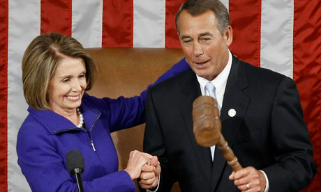 The outgoing House Speaker Nancy Pelosi hands the gavel of office to her successor John Boehner