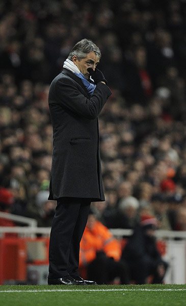 Arsenal v Manchester City: Roberto Mancini watches the match