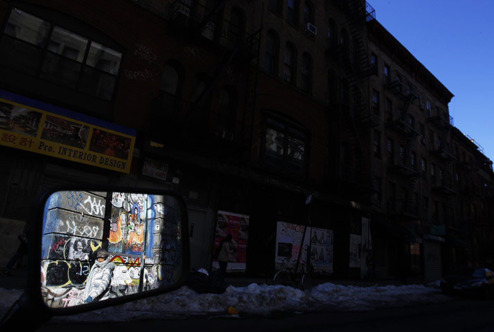 24 hours: New York, USA: A woman is reflected in a motorcycle mirror 
