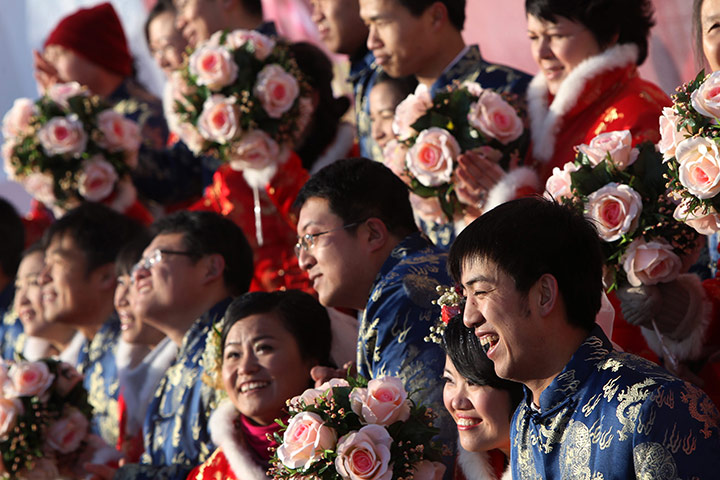24 hours: Harbin, China: Couples take their vows during a mass wedding