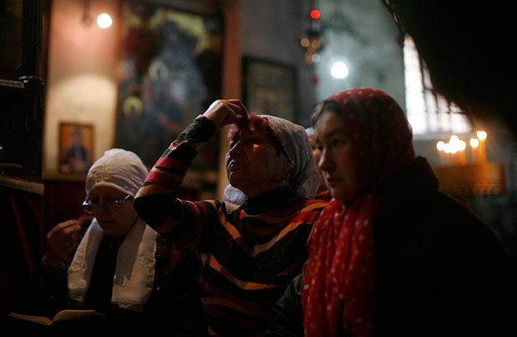 Orthodox Christmas: Russian pilgrims pray during Orthodox Christmas in Church of the Nativity