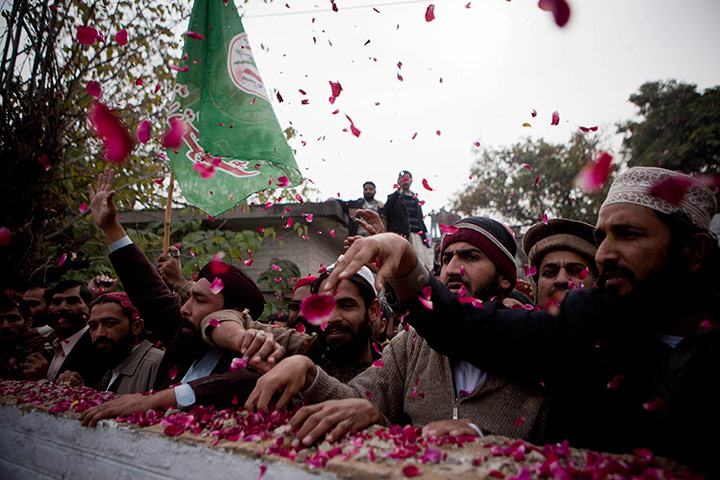 24 hours in pictures: Supporters of Pakistani religious party Sunni Tehreek chant slogans