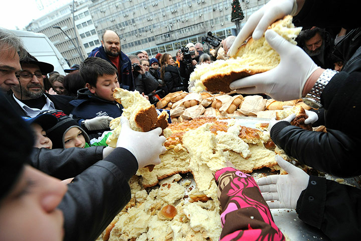 Orthodox Christmas: Christian Serb Orthodox believers share a traditional Christmas bread