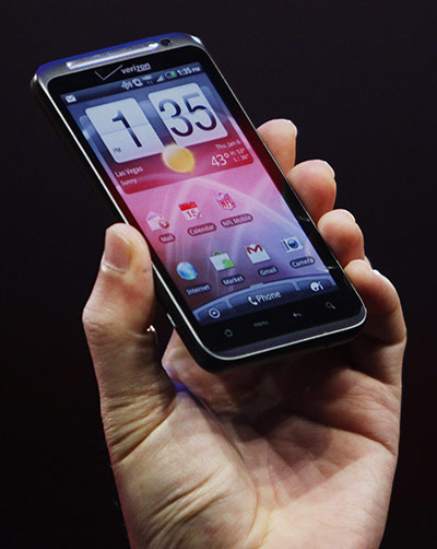 Consumer Electronics Show: HTC CEO Chou holds up a HTC 