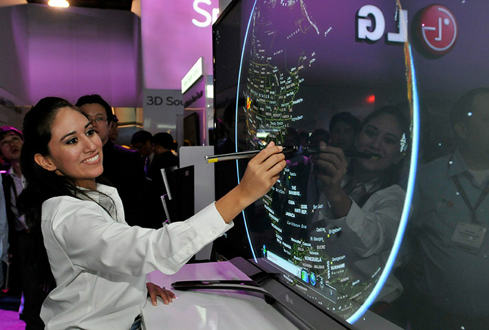 Consumer Electronics Show: Product demonstrator Michelle Rodriguez uses the LG Touch TV