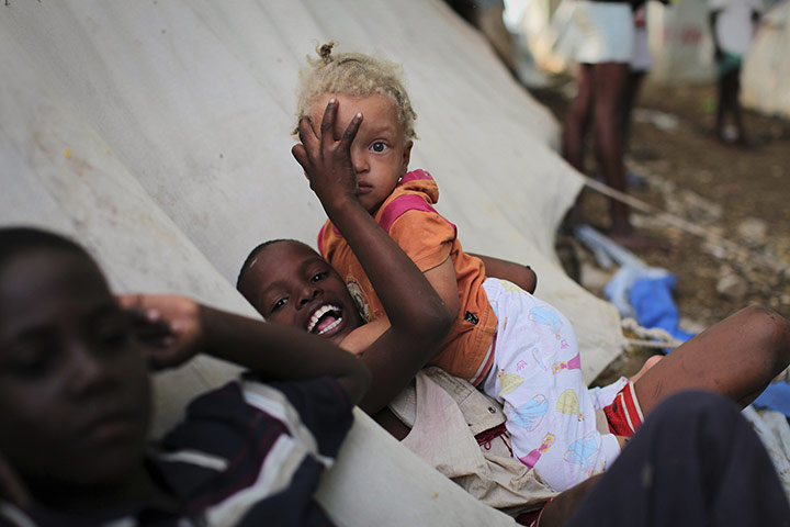 24 Hour: Children play in an internally displaced persons camp in Port-au-Prince