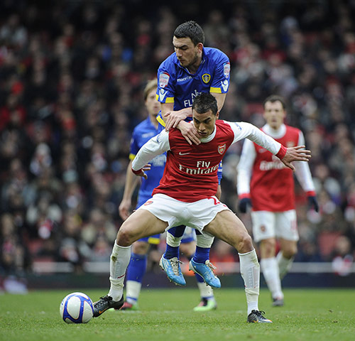 Arsenal v Leeds: Arsenal's Chamakh tries to shield the ball from Leeds' Snodgrass